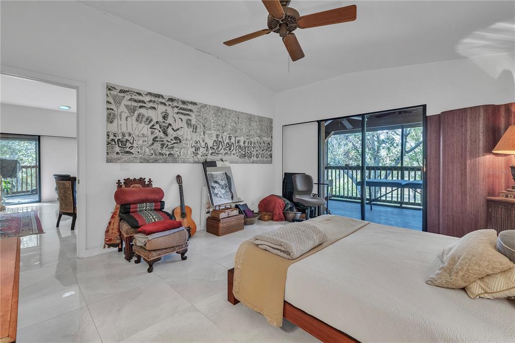 8056 Southwest Horse Creek Road Arcadia, FL 34266 - Photo 20 of 42 a bed room with a bed and a chair