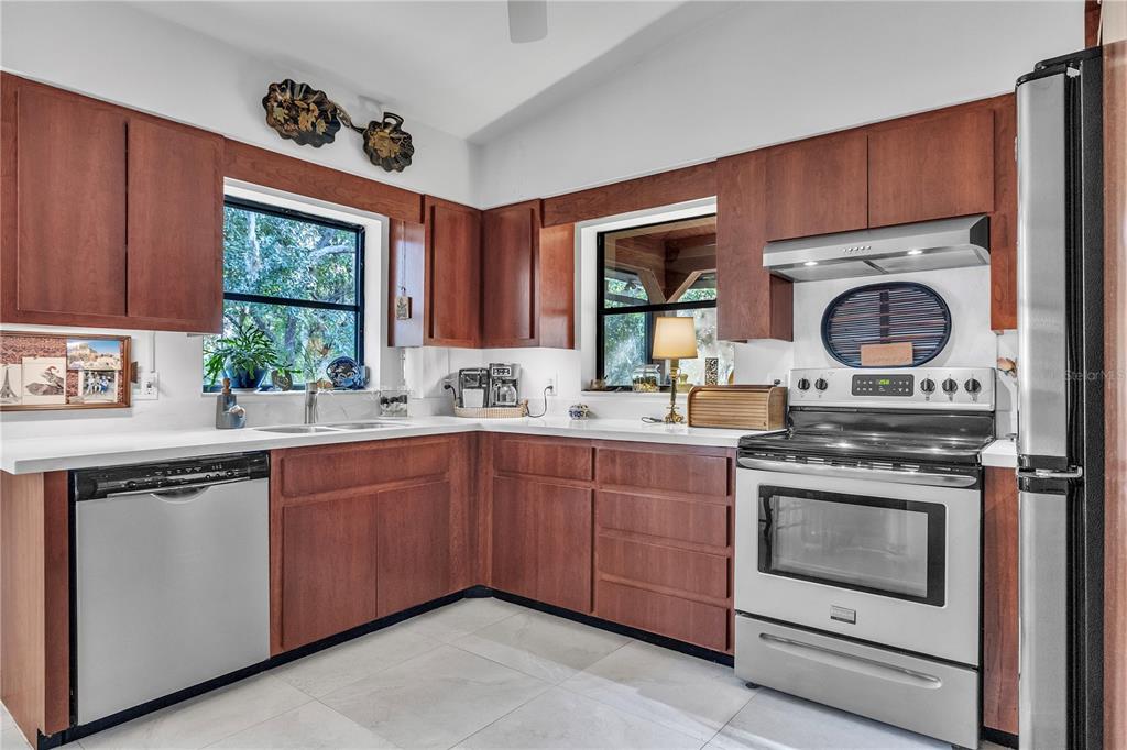 8056 Southwest Horse Creek Road Arcadia, FL 34266 - Photo 26 of 42 a kitchen with a stove a sink and a window