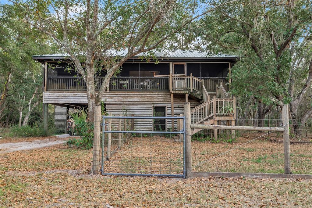 8056 Southwest Horse Creek Road Arcadia, FL 34266 - Photo 42 of 42 a front view of a house with a yard