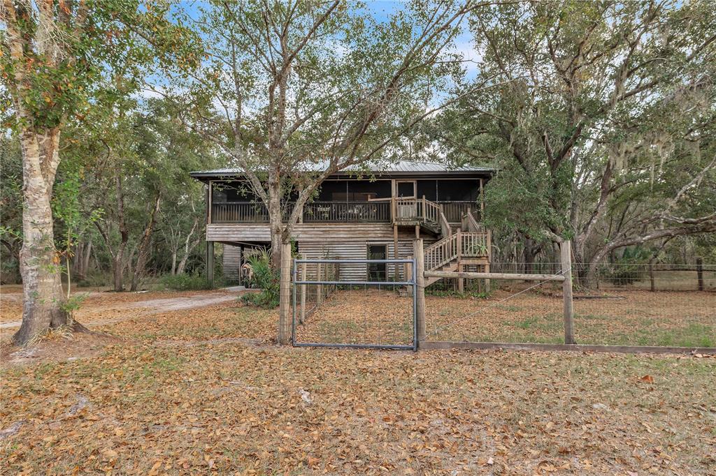 8056 Southwest Horse Creek Road Arcadia, FL 34266 - Photo 7 of 42 front view of a house with a yard