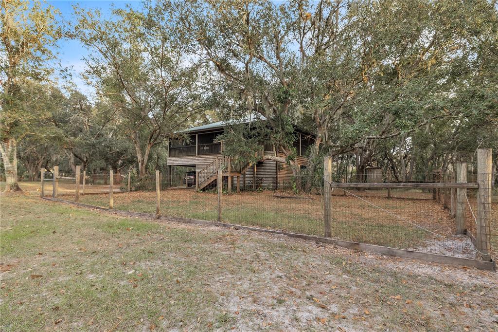 8056 Southwest Horse Creek Road Arcadia, FL 34266 - Photo 8 of 42 a view of a house with a yard