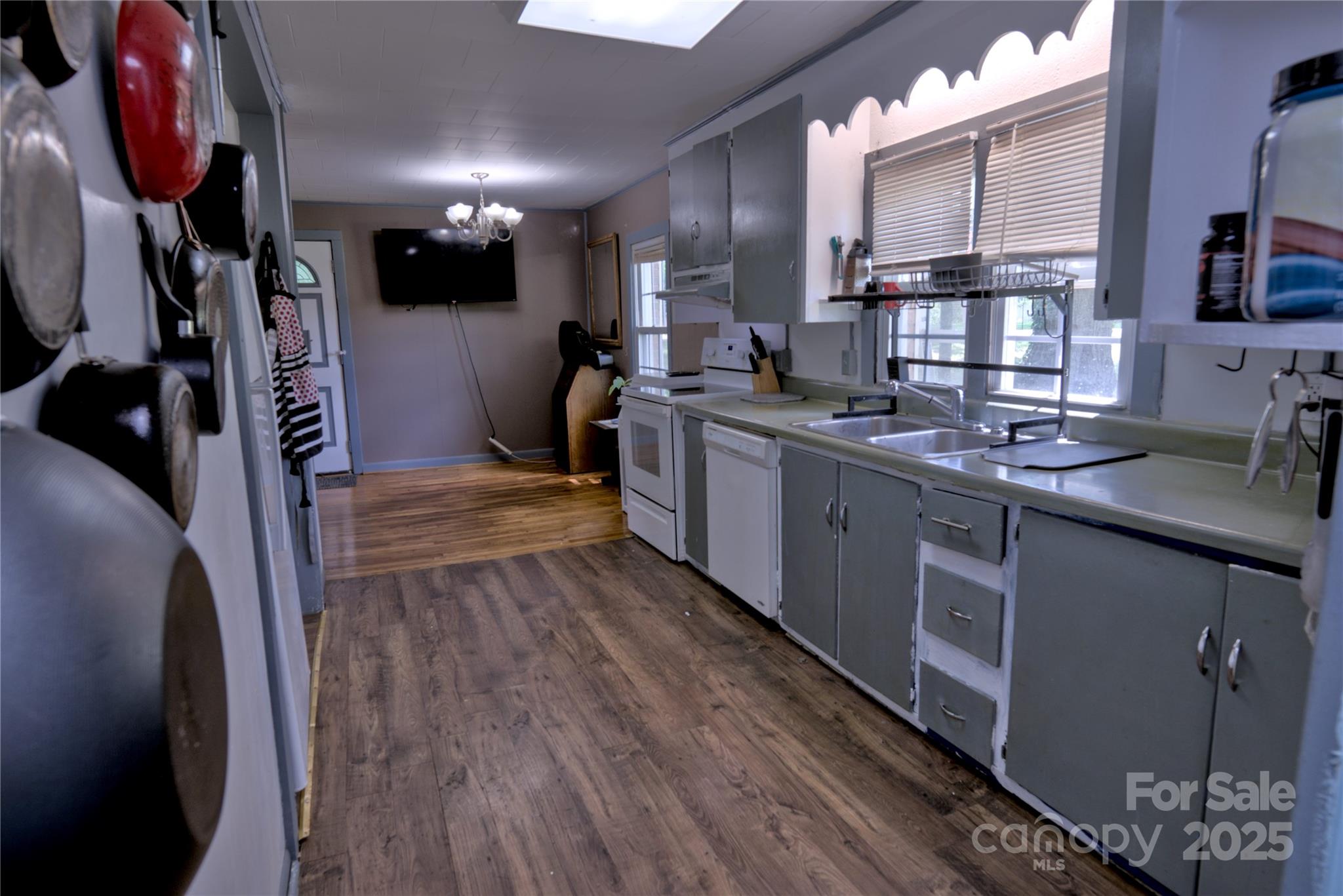 515 Upper Spencer Mountain Road Stanley, NC 28164 - Photo 11 of 24 a kitchen with stainless steel appliances granite countertop a sink stove and cabinets