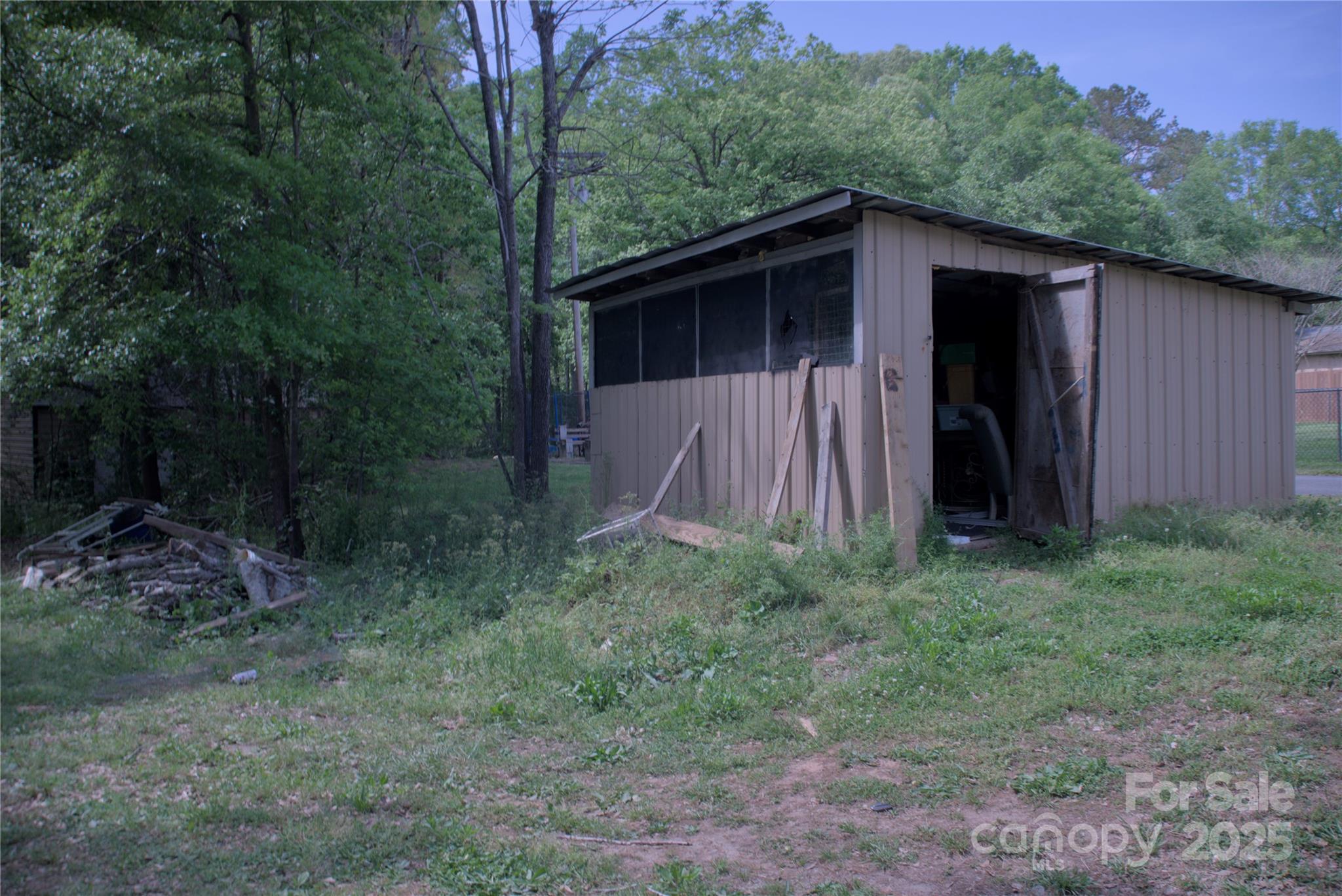 515 Upper Spencer Mountain Road Stanley, NC 28164 - Photo 24 of 24 a backyard of a house with lots of green space