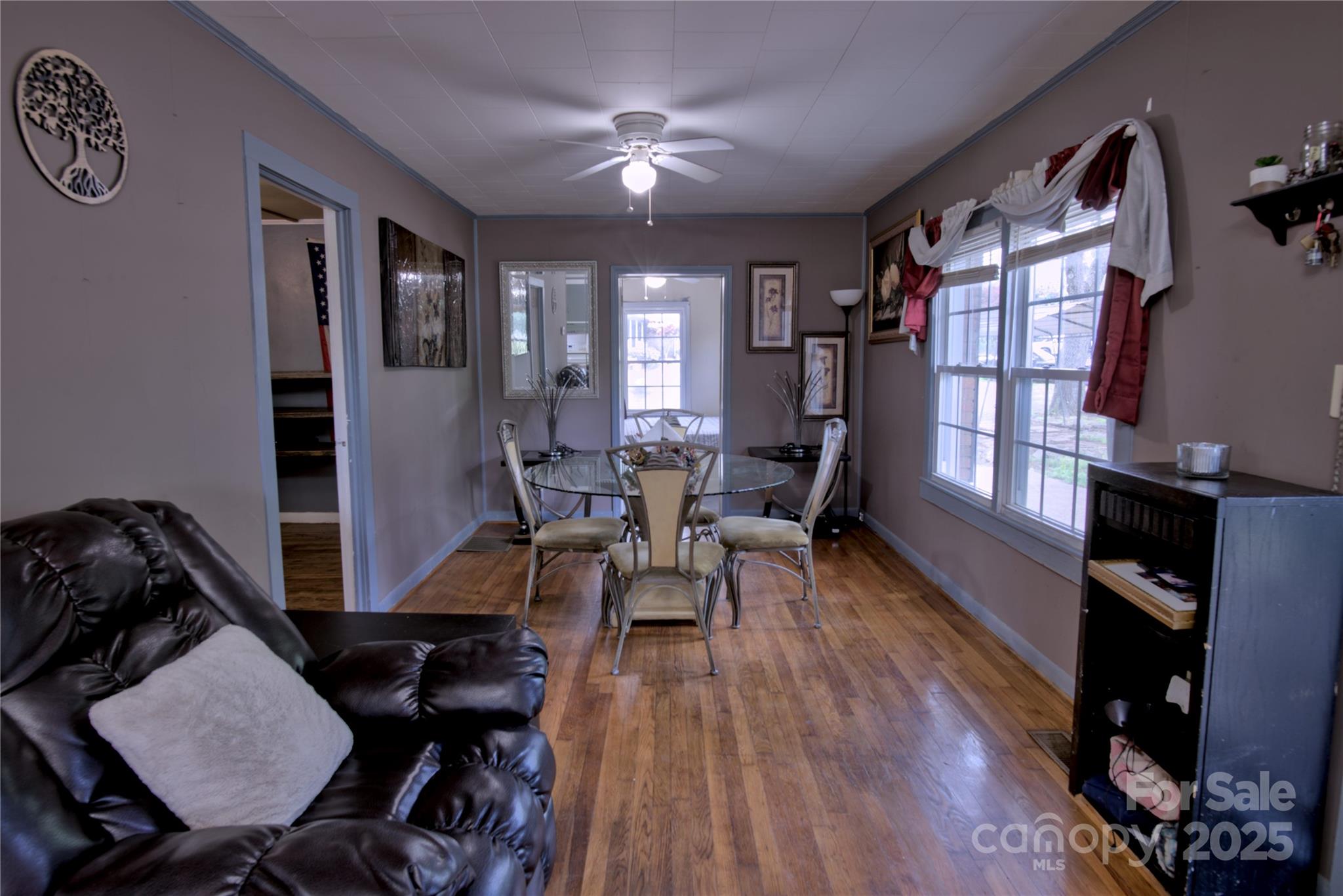 515 Upper Spencer Mountain Road Stanley, NC 28164 - Photo 4 of 24 a view of a livingroom with furniture and a flat screen tv
