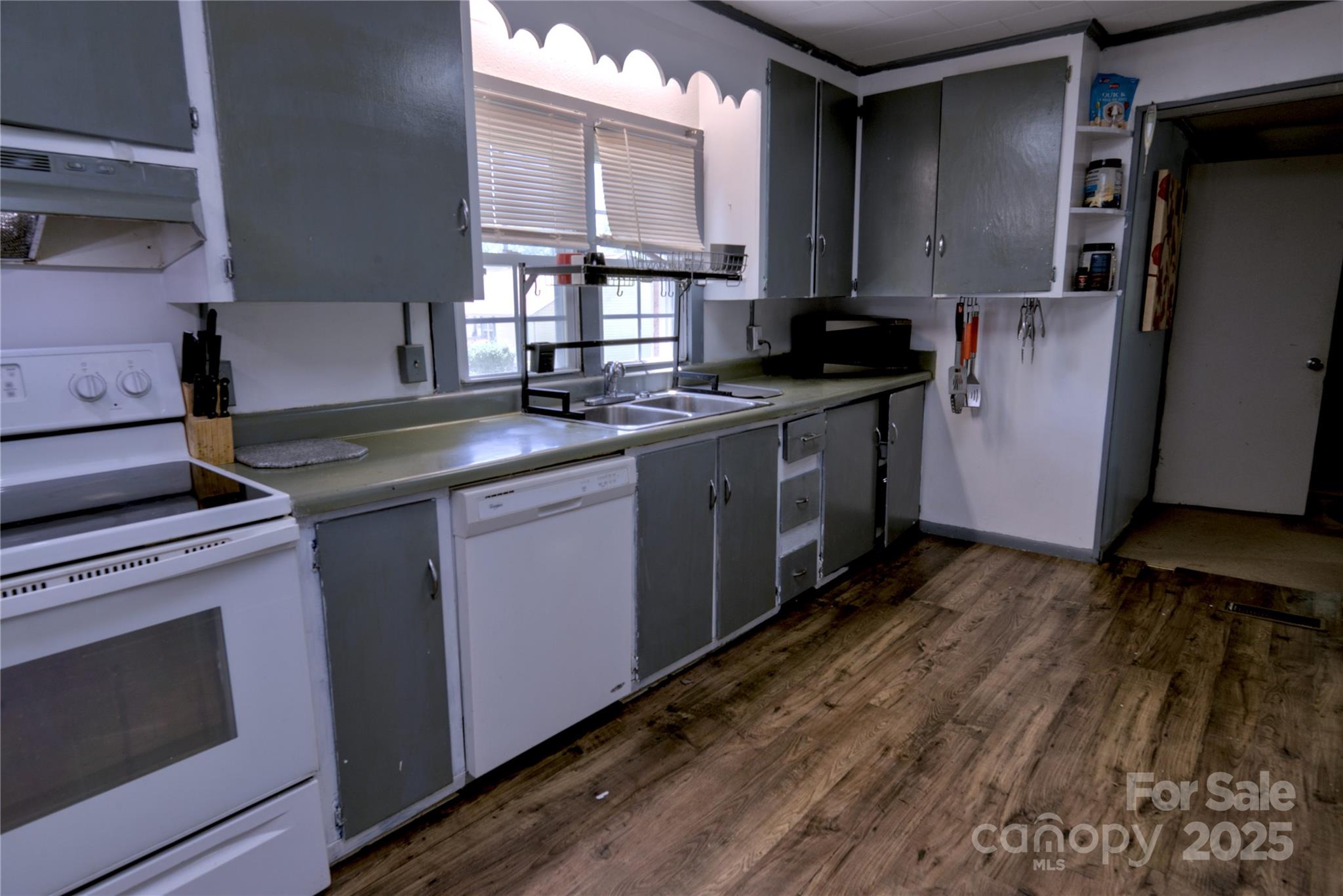 515 Upper Spencer Mountain Road Stanley, NC 28164 - Photo 9 of 24 a kitchen with stainless steel appliances granite countertop a sink stove and refrigerator