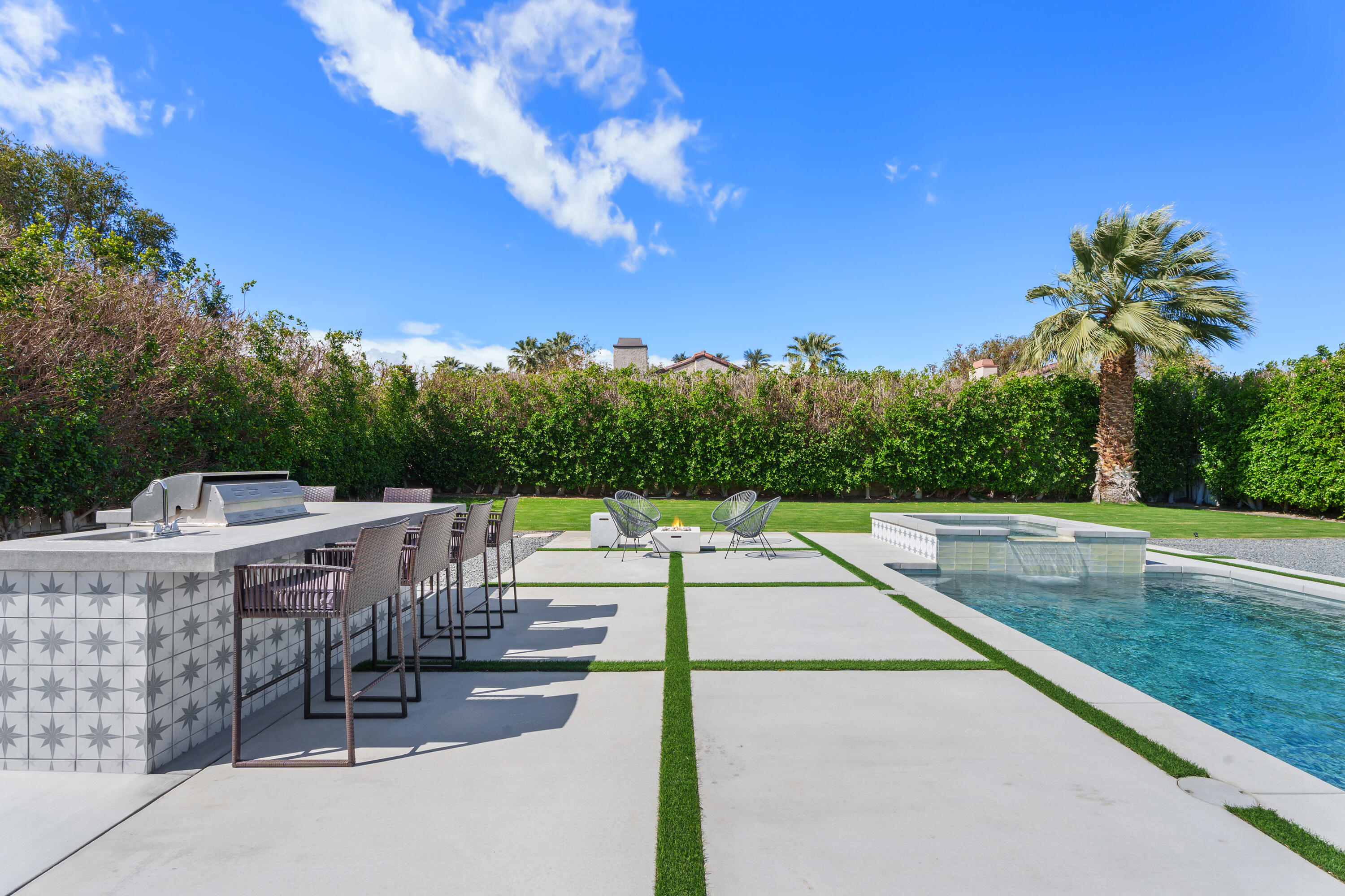 37081 Palmdale Road Rancho Mirage, CA 92270 - Photo 4 of 46 a view of a patio with swimming pool and sitting area