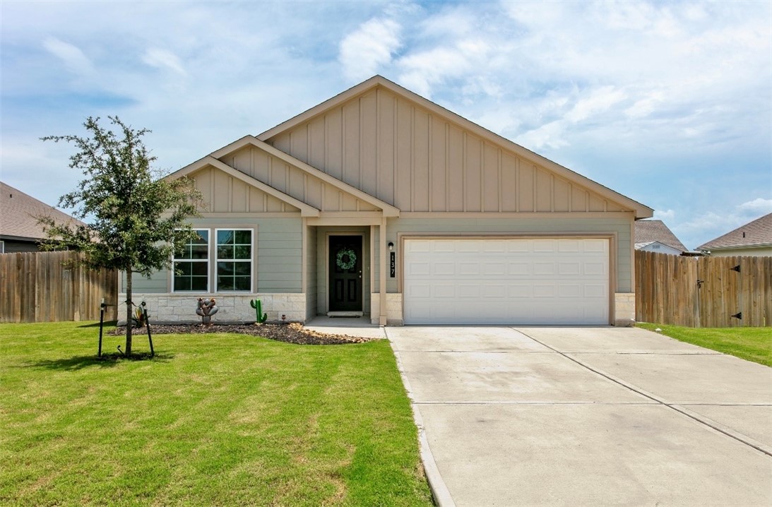 137 Windmill Road Somerville, TX 77879 - Photo 1 of 17 a front view of house with a garden and trees