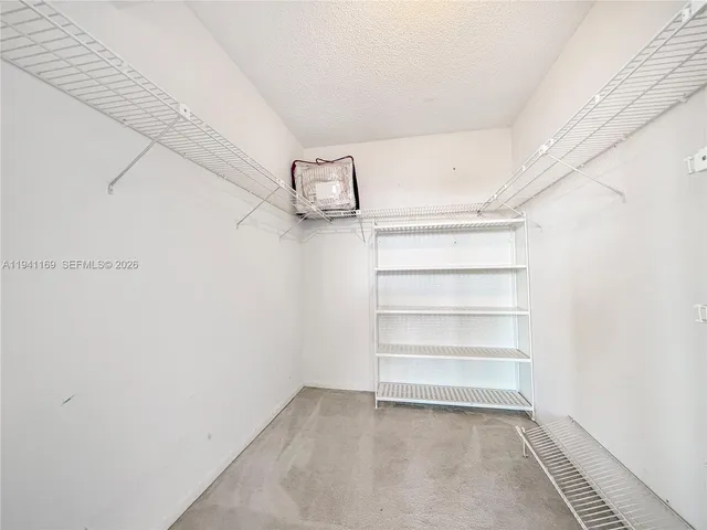 a view of a room with racks on the wall