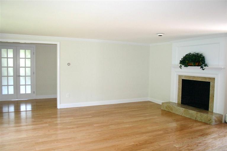 38 Leonard Road Hyannis, MA 02601 - Photo 3 of 35 a view of empty room with wooden floor and fireplace