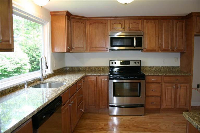 38 Leonard Road Hyannis, MA 02601 - Photo 8 of 35 a kitchen with granite countertop a stove and a sink