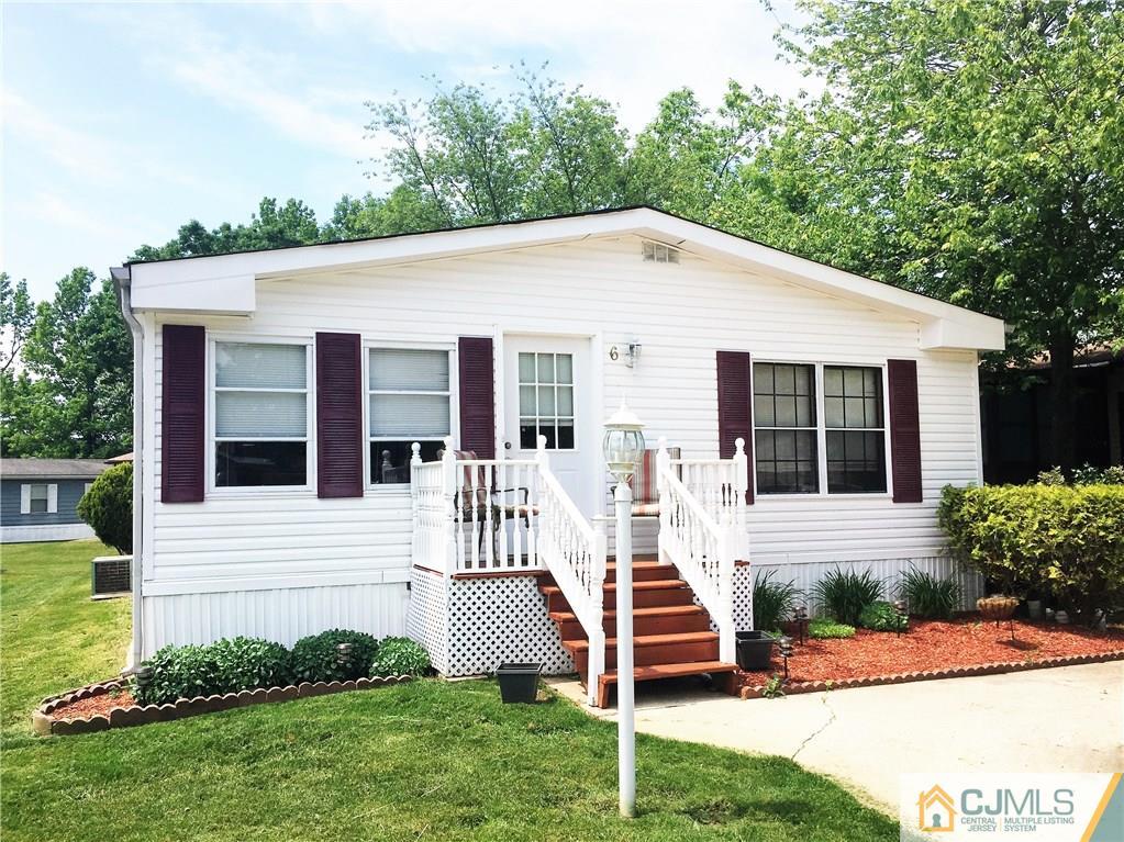 6 Byron Road, Unit 6 North Brunswick, NJ 08902 - Photo 2 of 25 a front view of a house with a yard