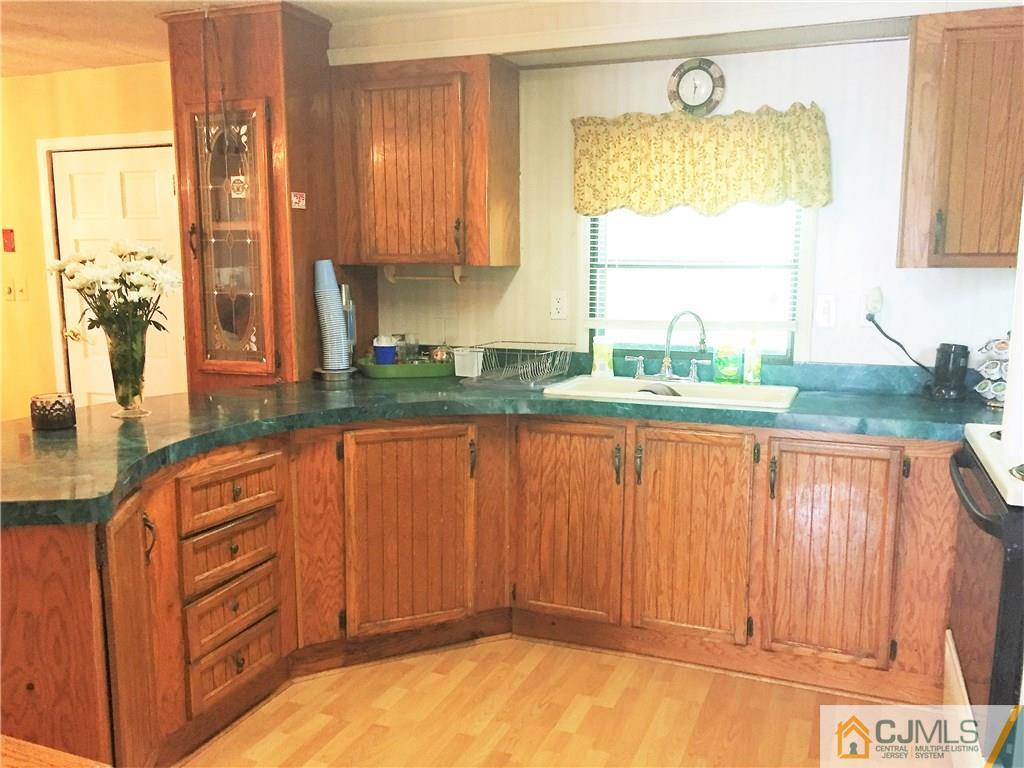 6 Byron Road, Unit 6 North Brunswick, NJ 08902 - Photo 17 of 25 a kitchen with stainless steel appliances a counter tops and a window