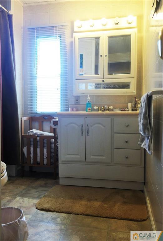 6 Byron Road, Unit 6 North Brunswick, NJ 08902 - Photo 21 of 25 a bathroom with a bathtub and a sink