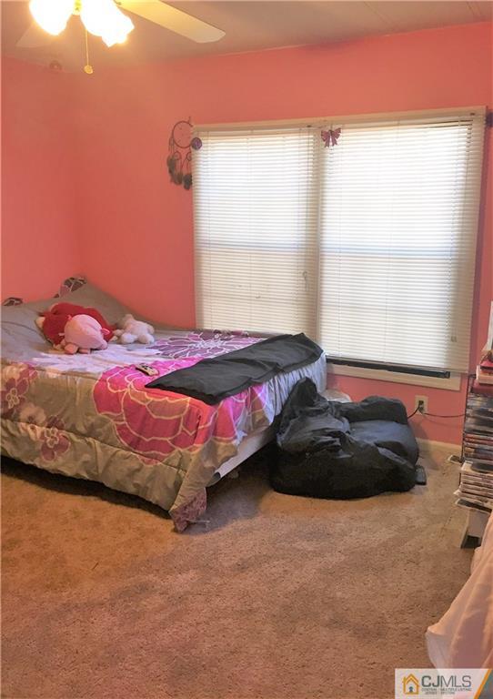6 Byron Road, Unit 6 North Brunswick, NJ 08902 - Photo 22 of 25 a bedroom with a bed and a window