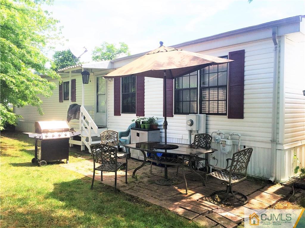 6 Byron Road, Unit 6 North Brunswick, NJ 08902 - Photo 24 of 25 a patio with tables and chairs