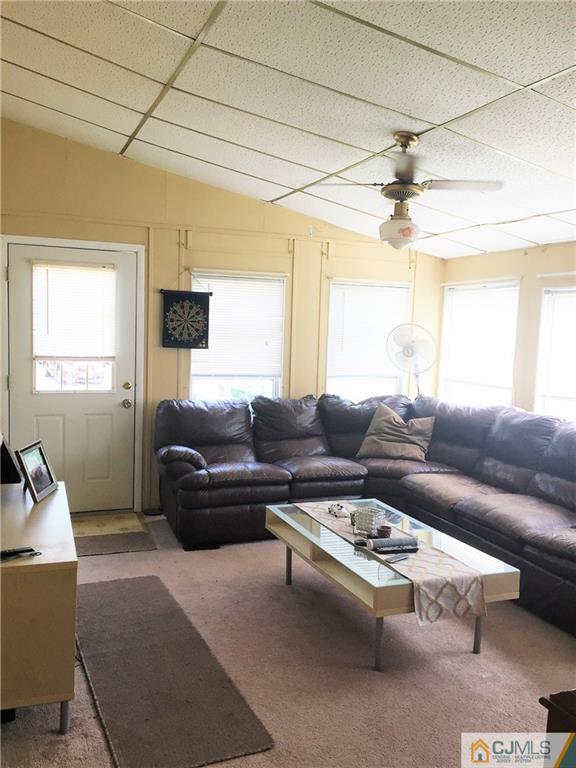 6 Byron Road, Unit 6 North Brunswick, NJ 08902 - Photo 6 of 25 a living room with furniture and a window