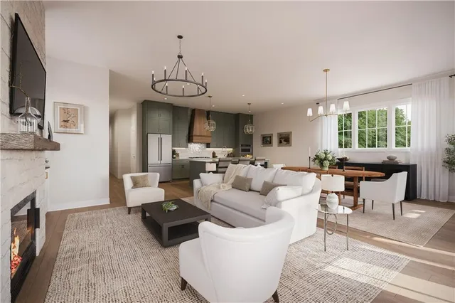 a living room with fireplace furniture and a flat screen tv