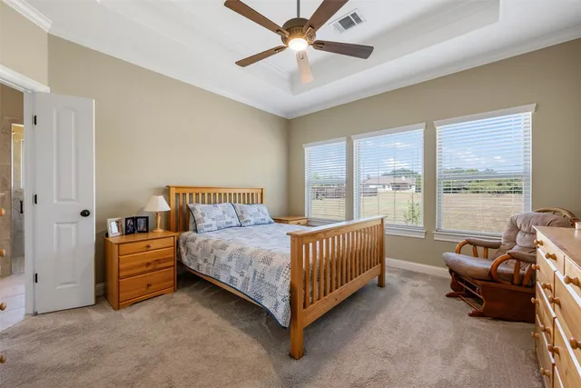 a bed room with a bed and a chandelier