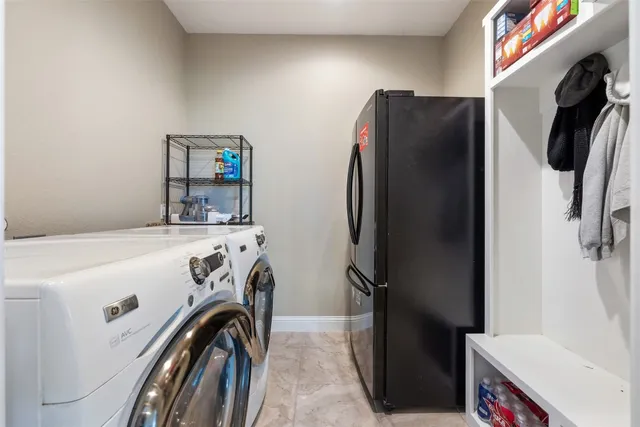 a house view with a garden space and outdoor seating