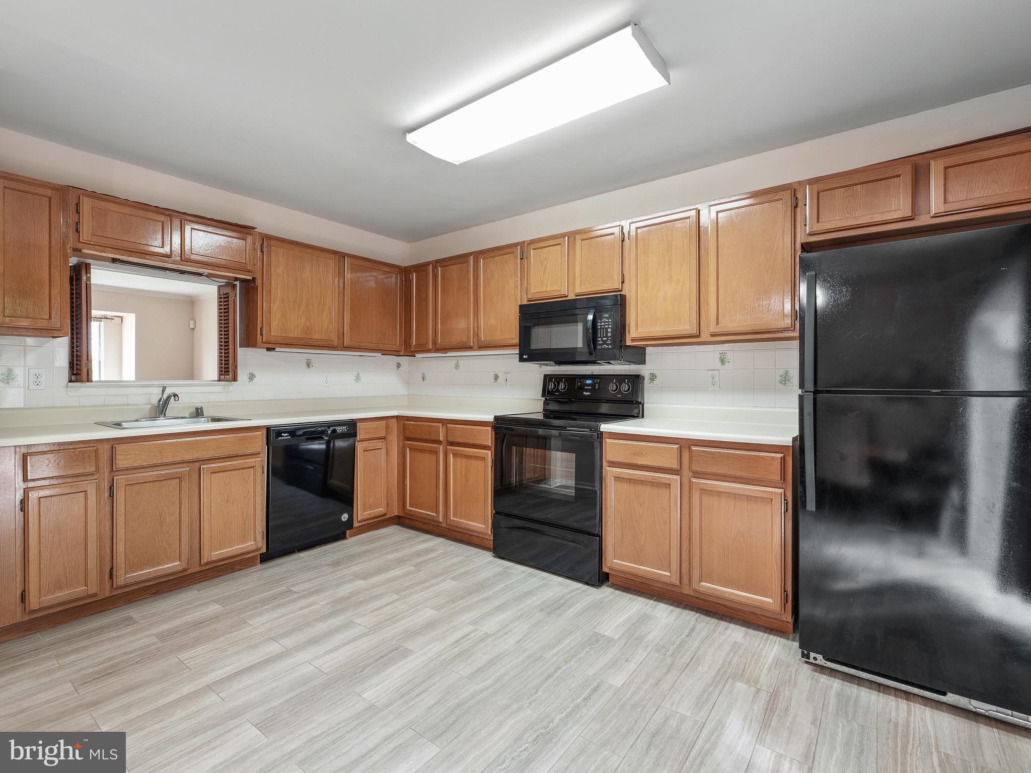 2039 Putnam Road Halethorpe, MD 21227 - Photo 8 of 32 Open kitchen with new appliances