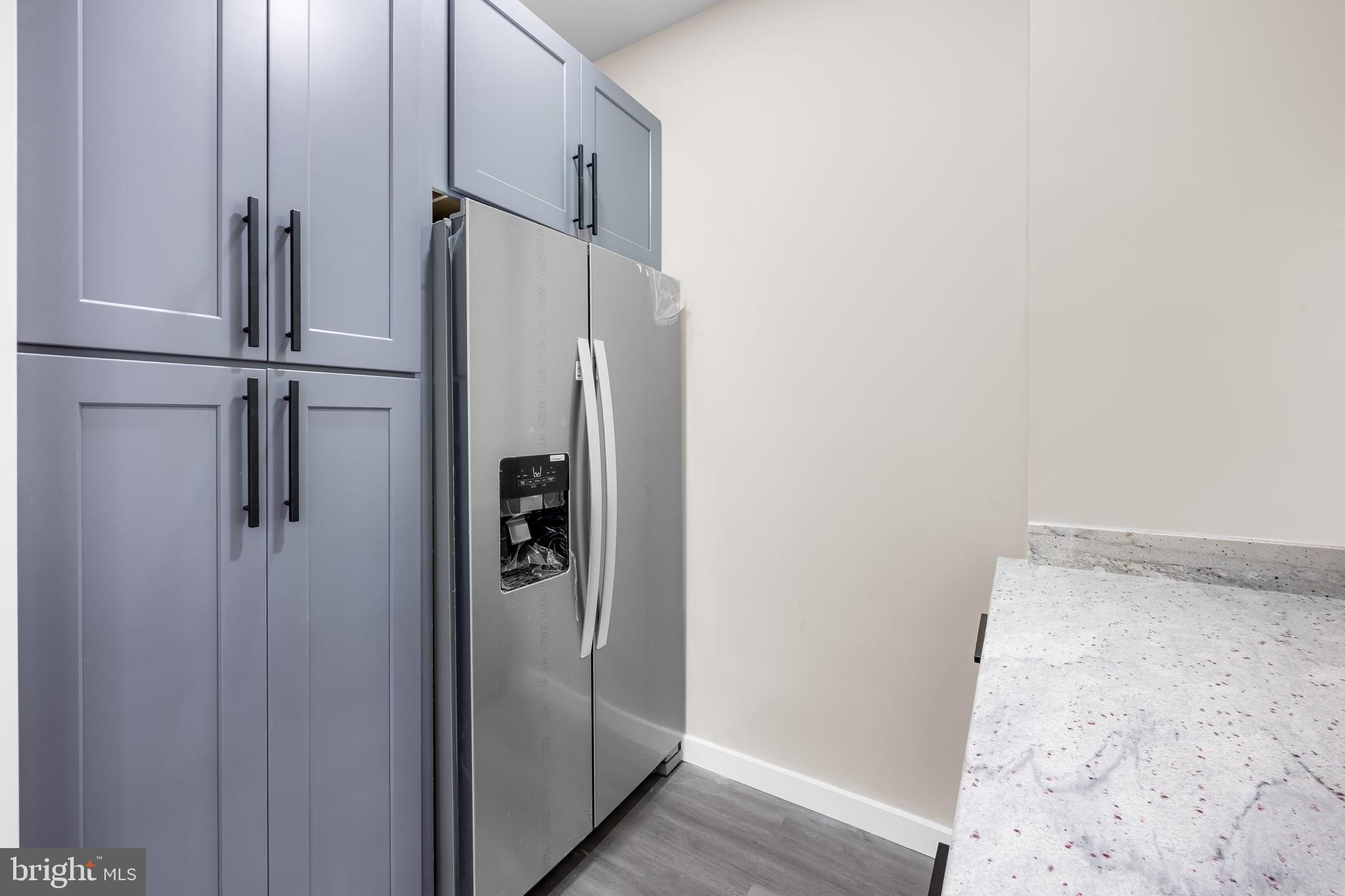 815 East 33rd Street Baltimore, MD 21218 - Photo 13 of 41 a bathroom with a glass shower door