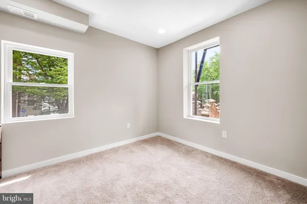 an empty room with windows