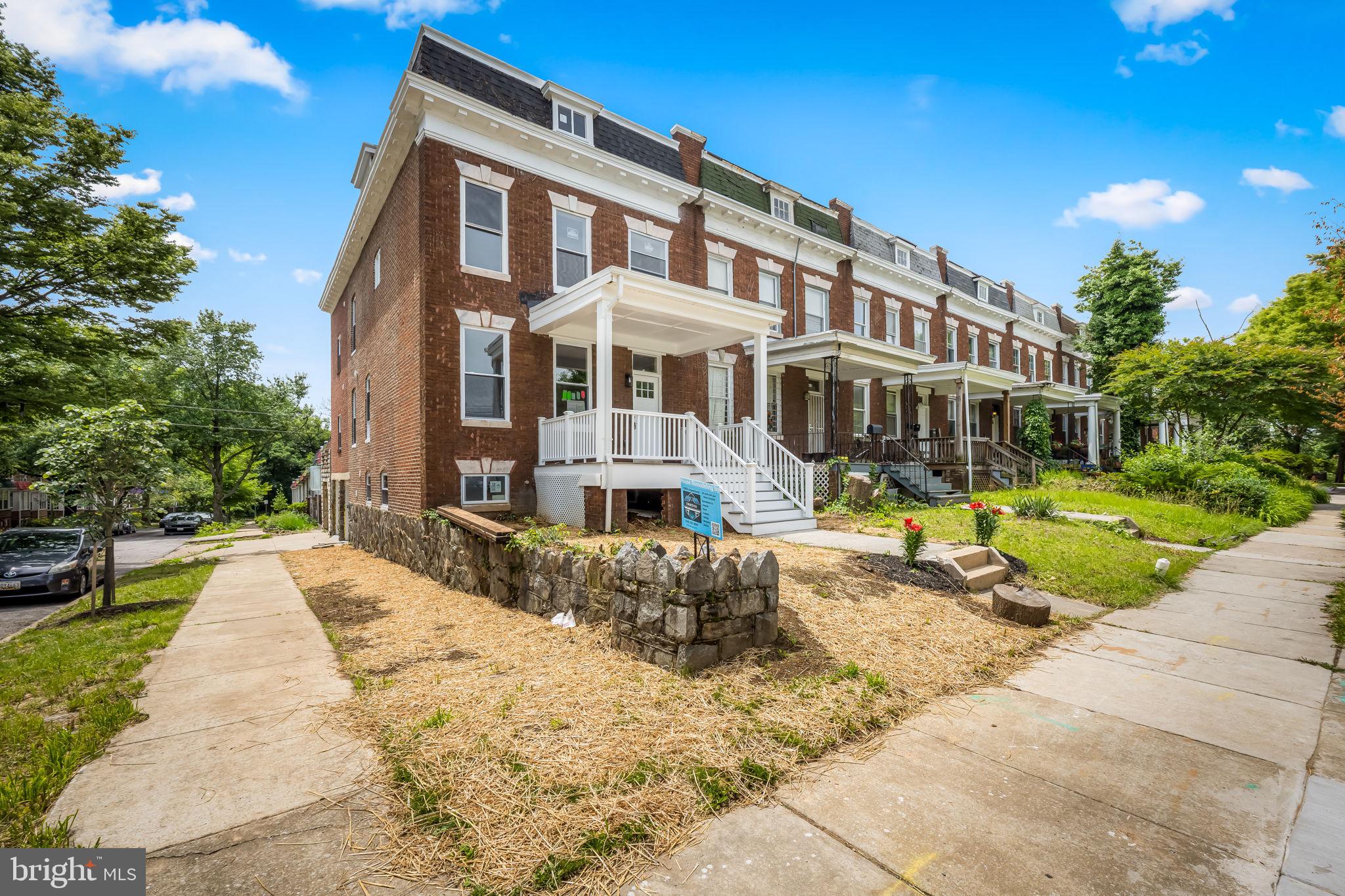 815 East 33rd Street Baltimore, MD 21218 - Photo 2 of 41 a front view of a house with a yard