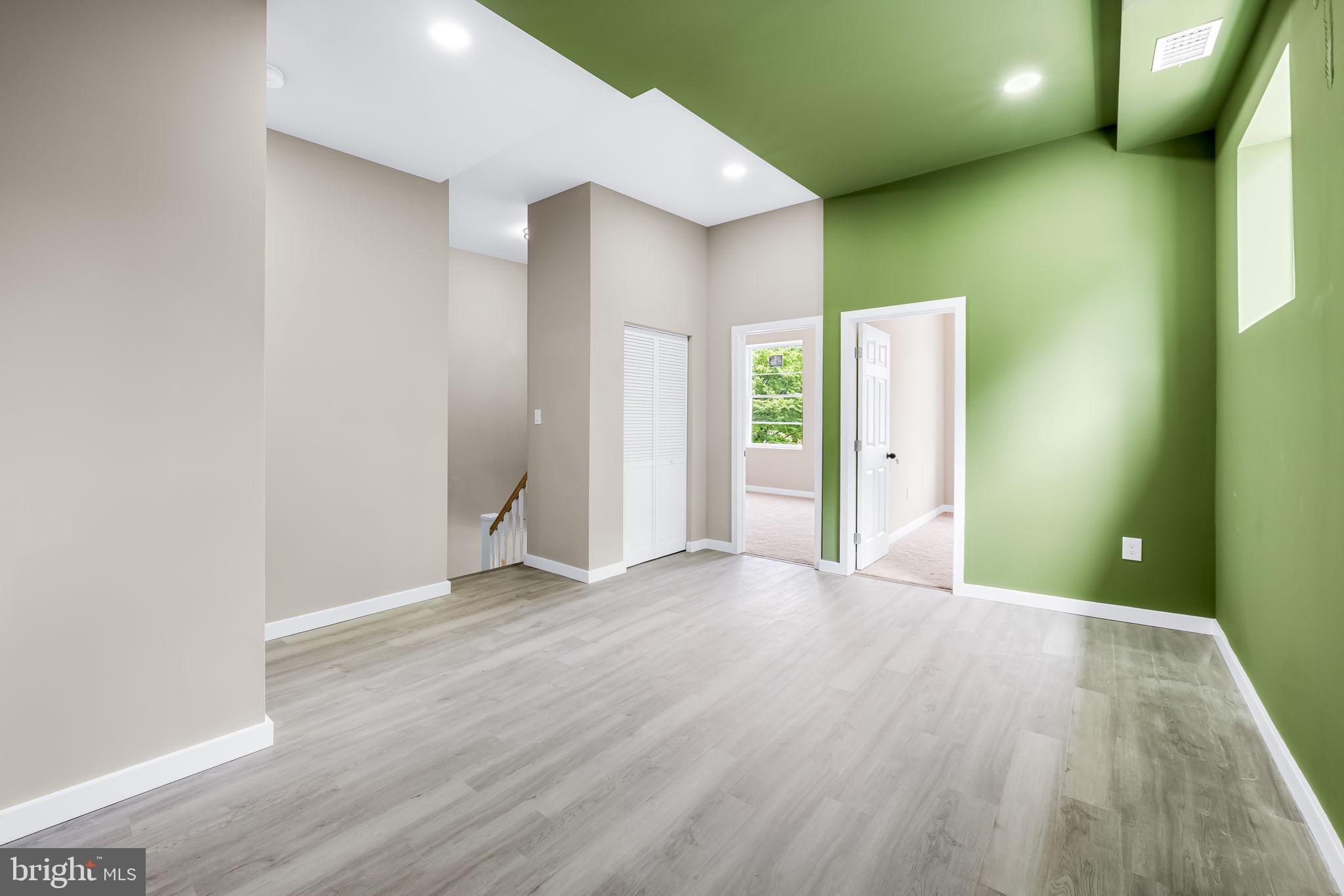 815 East 33rd Street Baltimore, MD 21218 - Photo 22 of 41 a view of a big room with wooden floor and windows