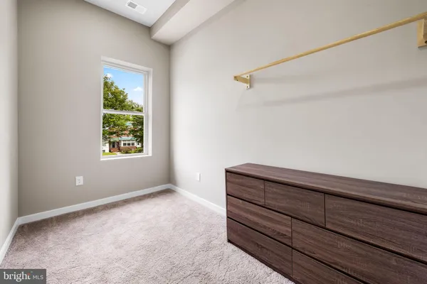a view of room with window and stairs