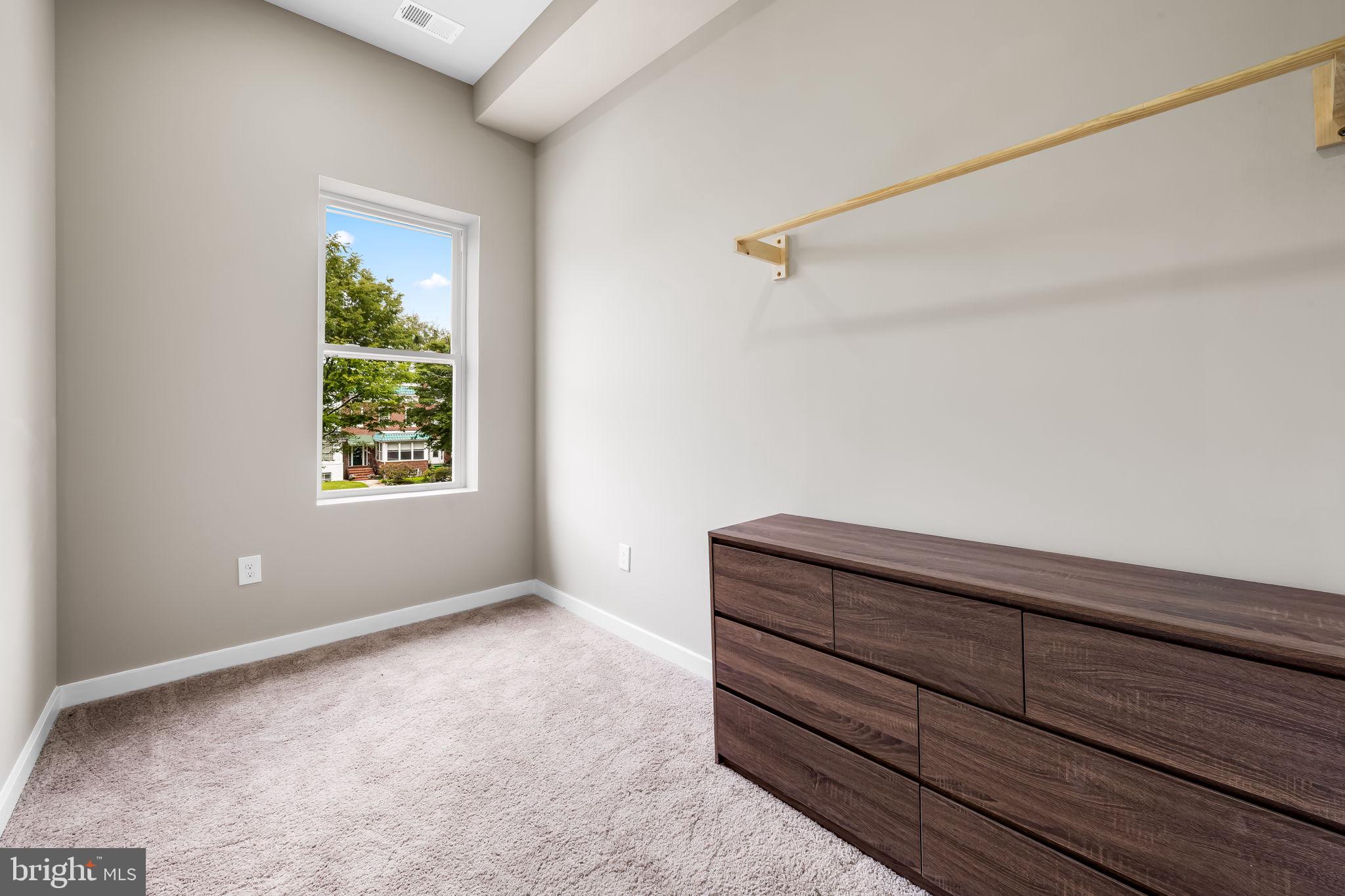815 East 33rd Street Baltimore, MD 21218 - Photo 24 of 41 a view of room with window and stairs