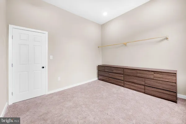 a view of room with wooden floor