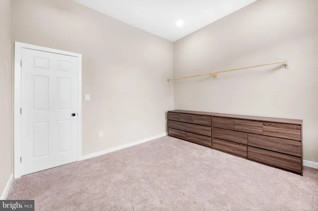 a view of room with wooden floor