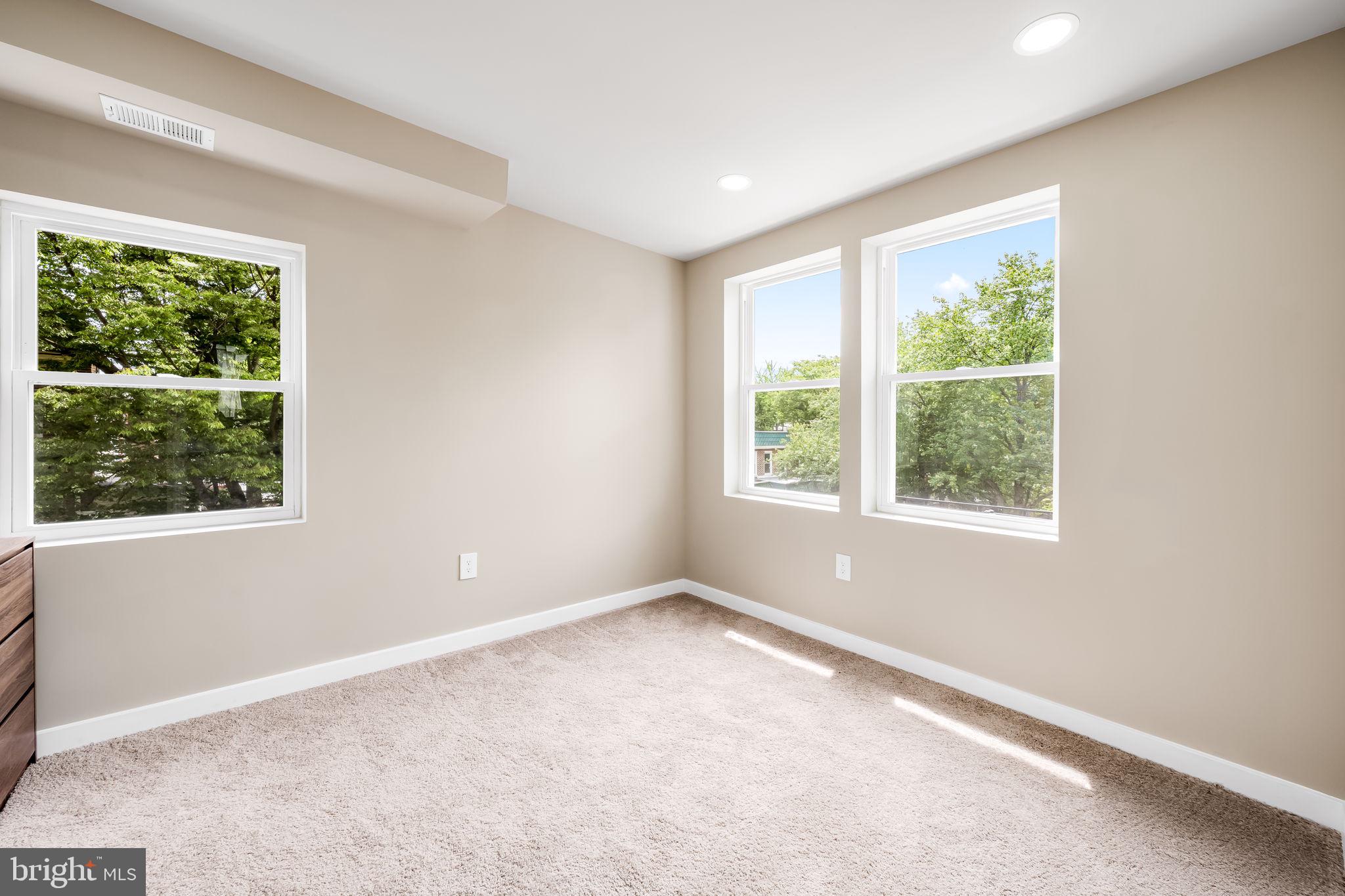815 East 33rd Street Baltimore, MD 21218 - Photo 33 of 41 an empty room with windows