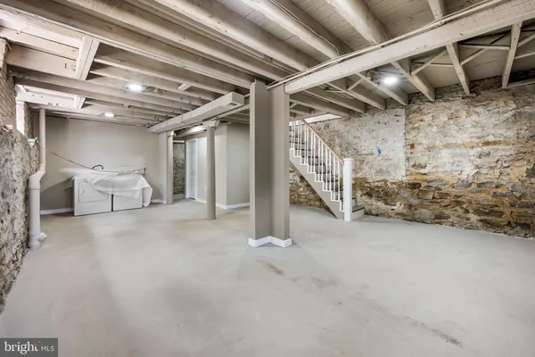 a view of an empty room with windows