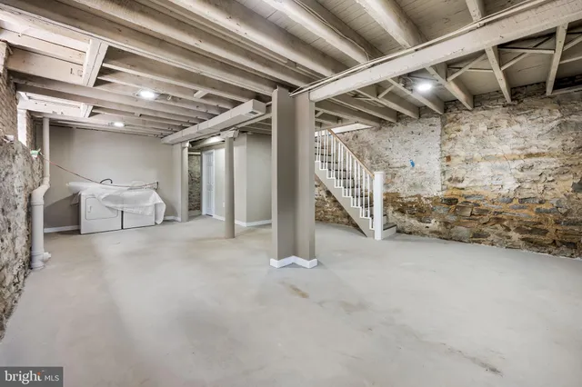 a view of an empty room with windows