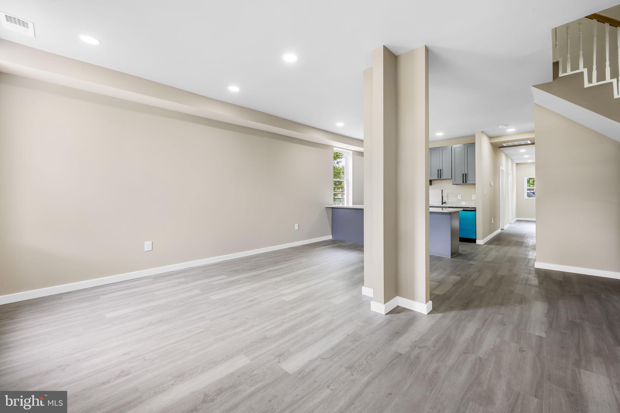 815 East 33rd Street Baltimore, MD 21218 - Photo 6 of 41 a view of empty room with wooden floor