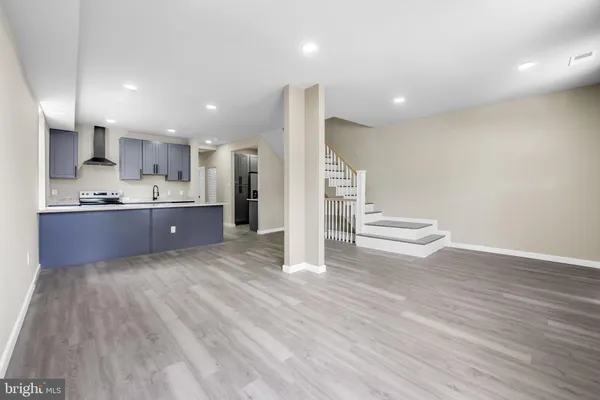 a view of kitchen and wooden floor