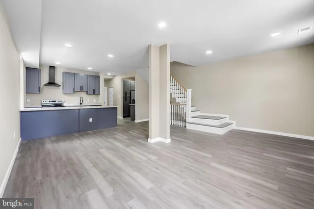a view of kitchen and wooden floor
