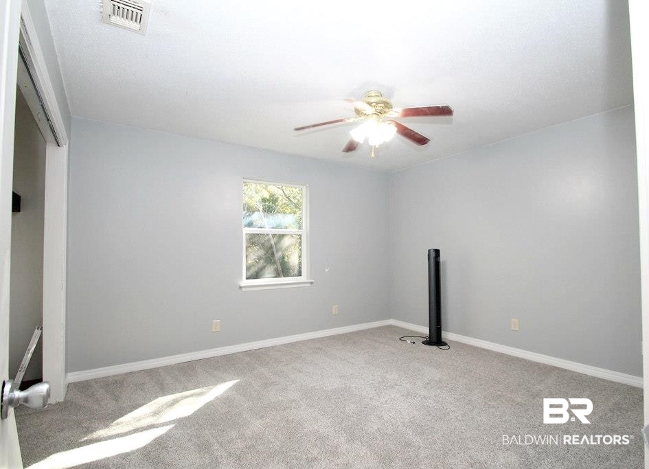 205 Montclair Loop Daphne, AL 36526 - Photo 13 of 19 Unfurnished bedroom featuring light colored carpet and ceiling fan