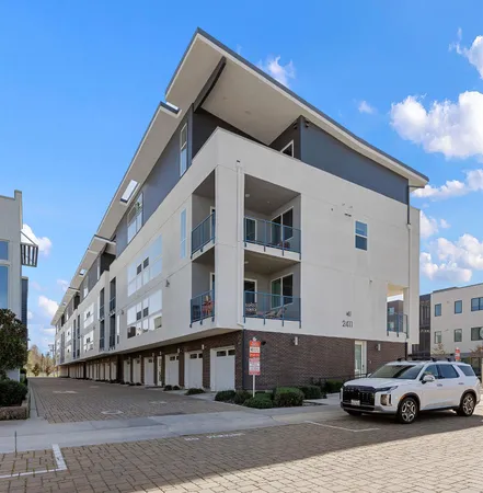 a view of a car park in front of a building