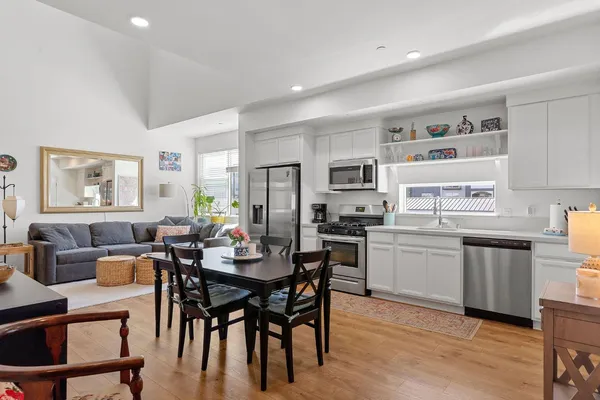 a view of a dining room with furniture and wooden floor