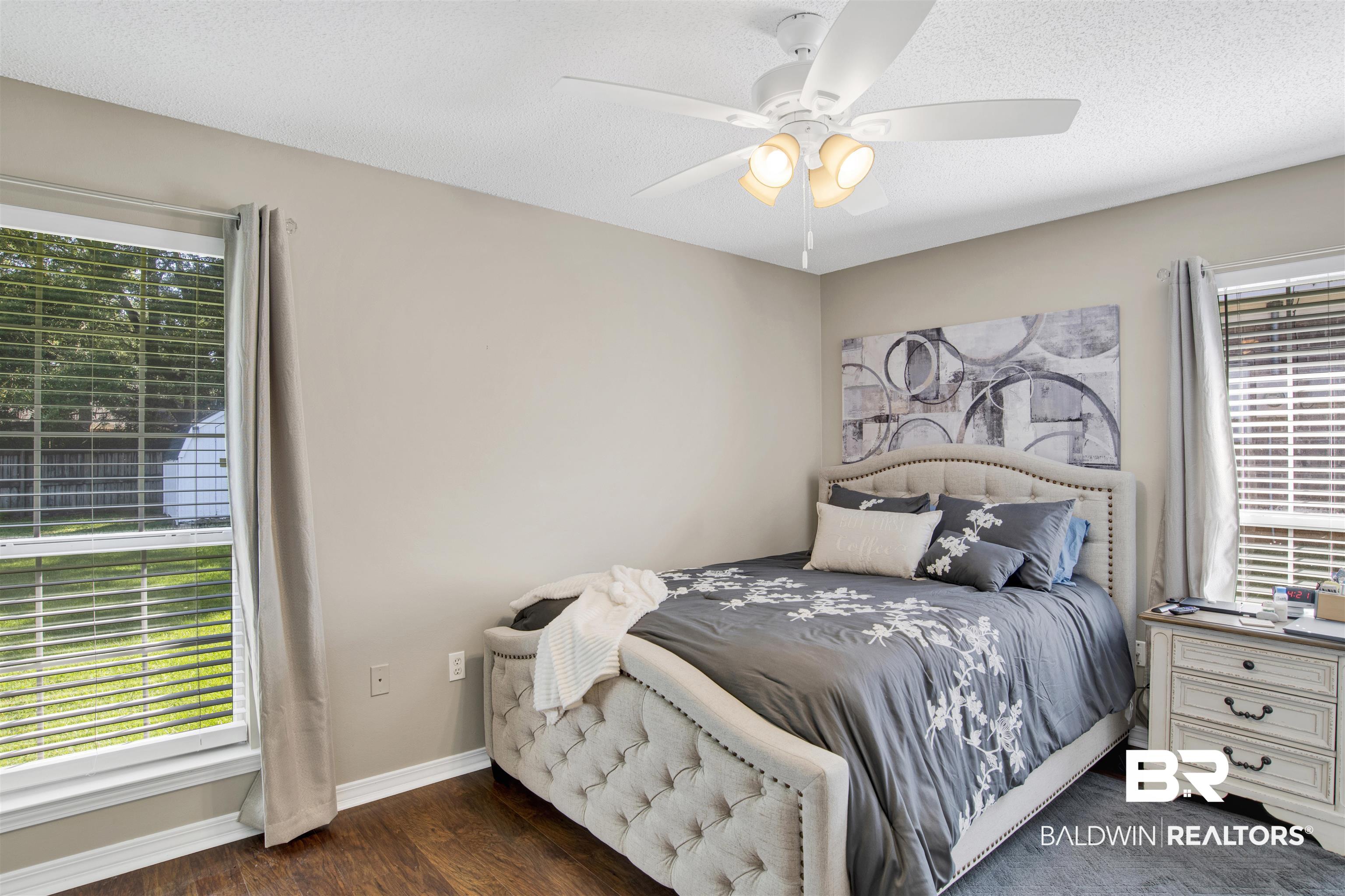 6281 Woodside Drive Theodore, AL 36582 - Photo 10 of 17 Bedroom with wood finished floors, a textured ceiling, and a ceiling fan