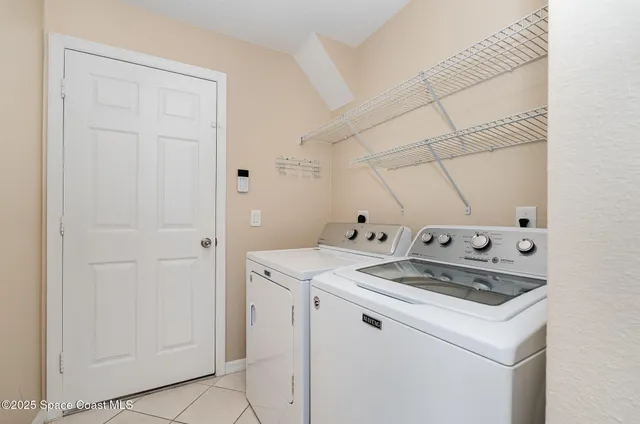 a utility room with washer and dryer