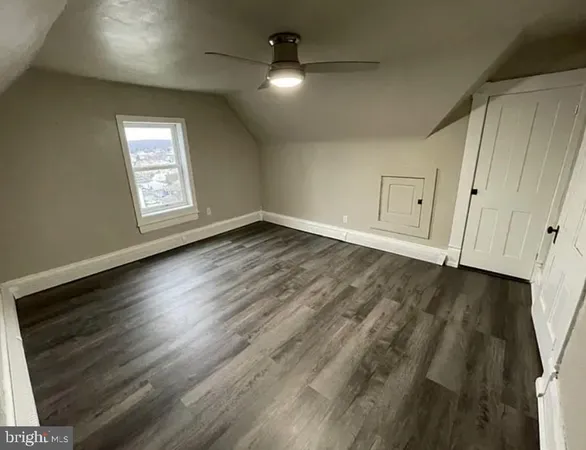 a kitchen with stainless steel appliances granite countertop a refrigerator a sink and a stove