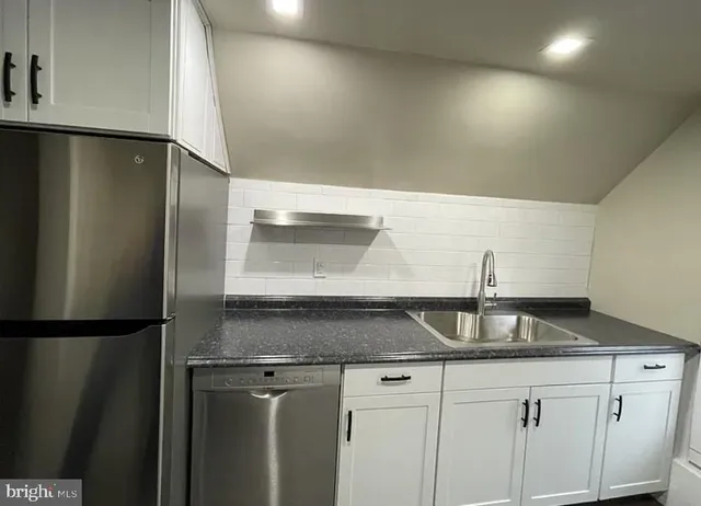 an empty room with wooden floor hallway and hallway