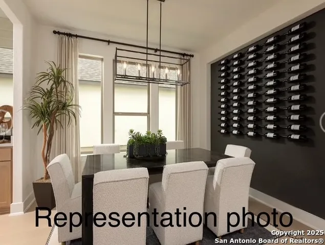 a dining room with furniture and window