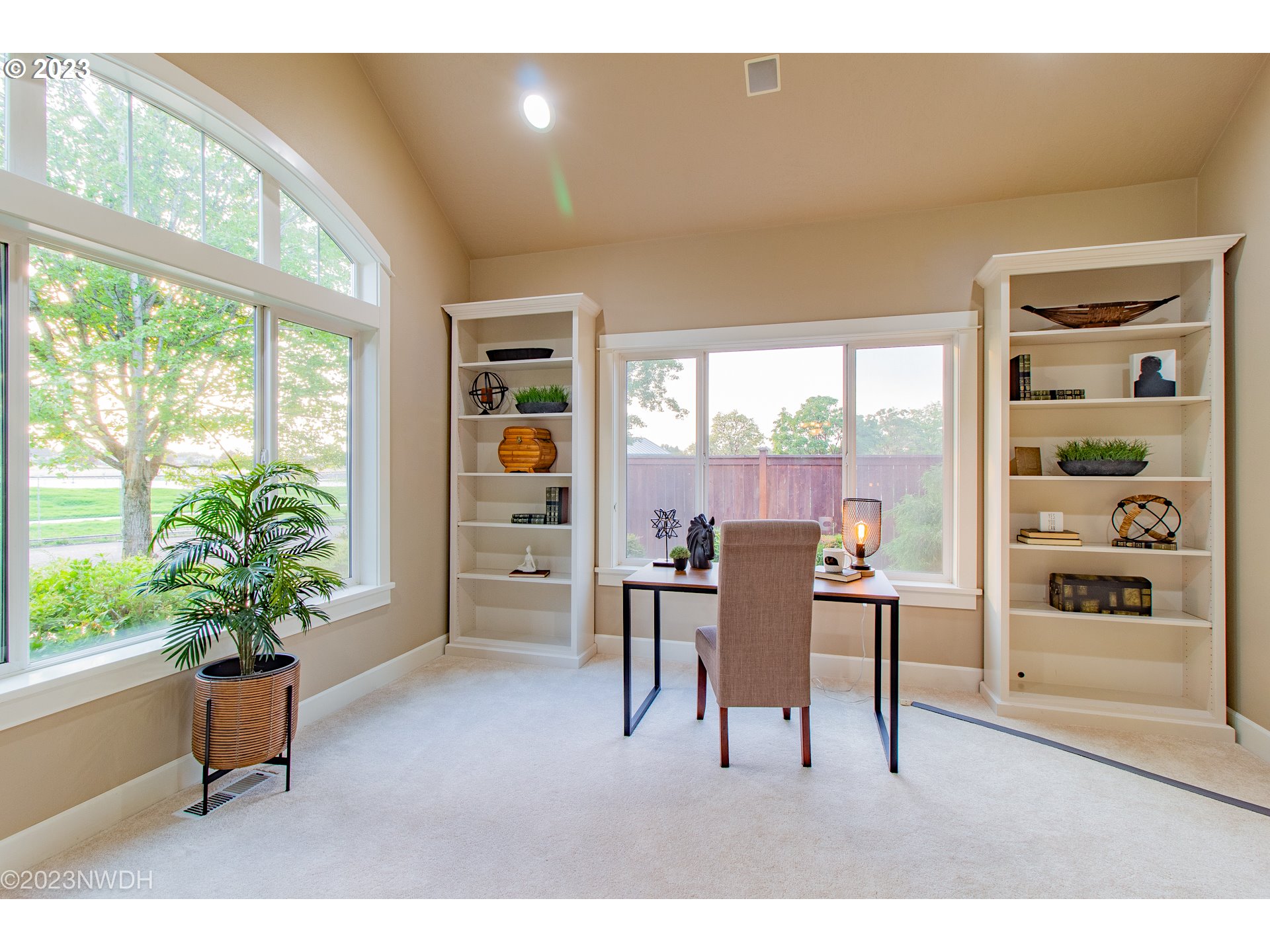 2983 Grand Cayman Drive Eugene, OR 97408 - Photo 11 of 43 a living room with furniture a potted plant and a large window