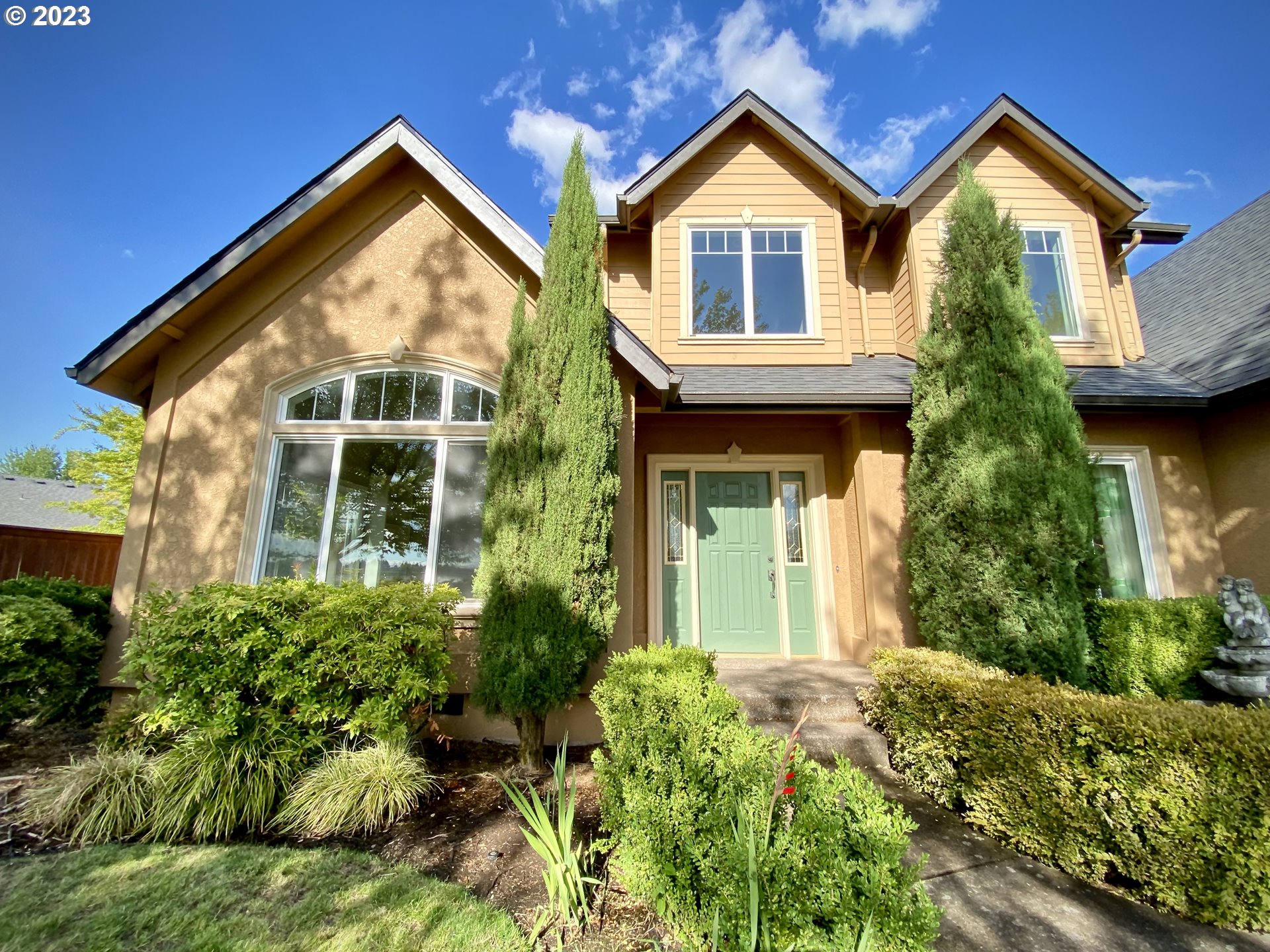 2983 Grand Cayman Drive Eugene, OR 97408 - Photo 2 of 43 a front view of a house with a yard