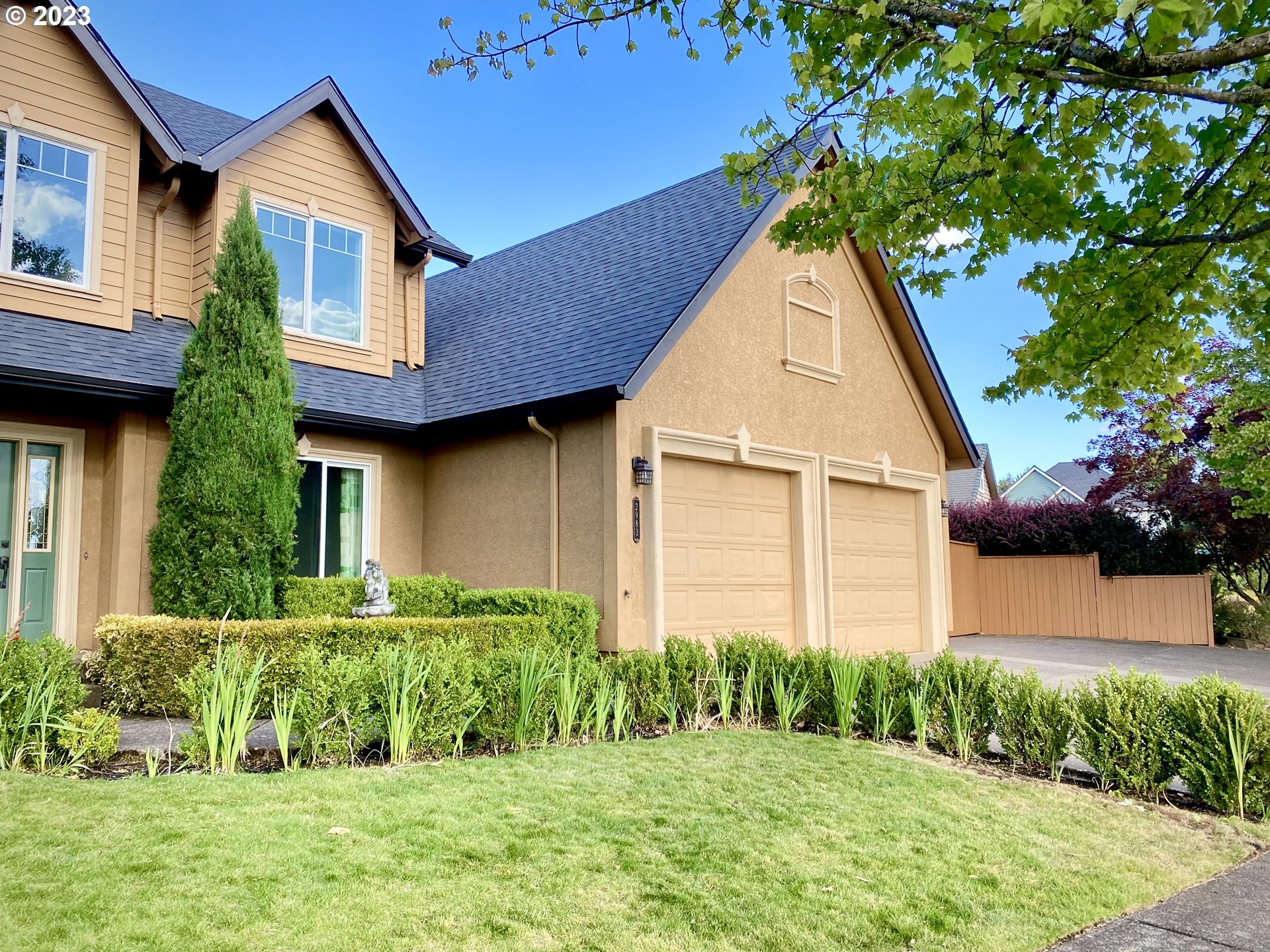 2983 Grand Cayman Drive Eugene, OR 97408 - Photo 3 of 43 a front view of a house with a yard