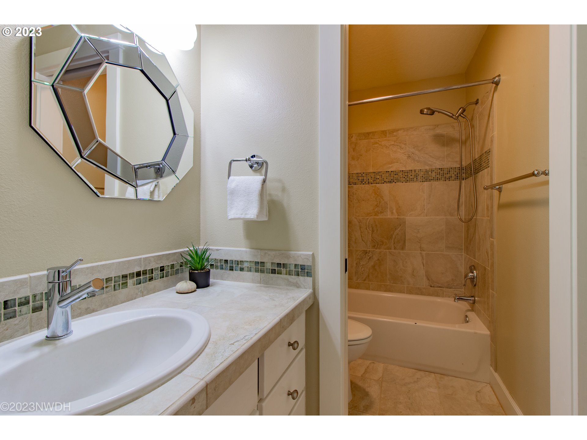 2983 Grand Cayman Drive Eugene, OR 97408 - Photo 34 of 43 a bathroom with a granite countertop sink a mirror and a shower